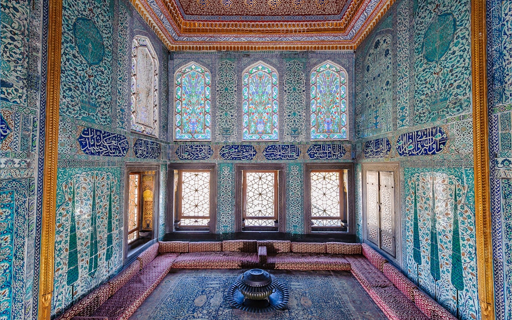 Topkapi Palace Harem section with intricate tilework and stained glass windows.