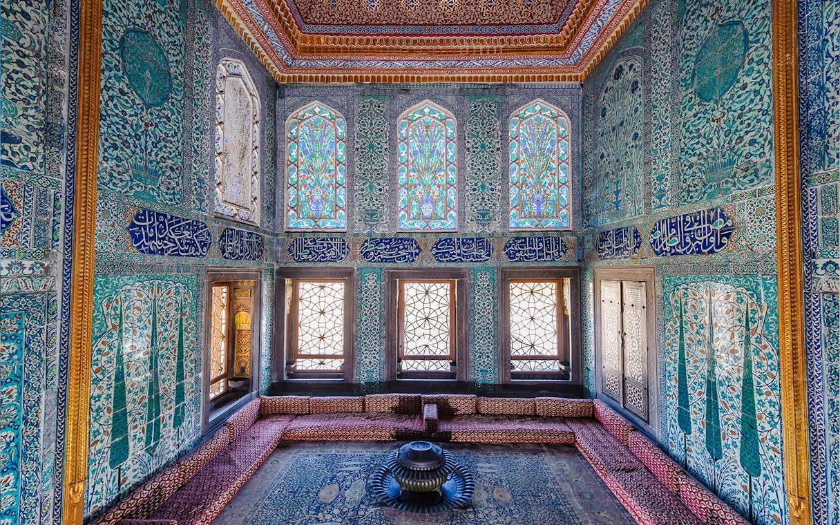 Topkapi Palace Harem section with intricate tilework and stained glass windows.