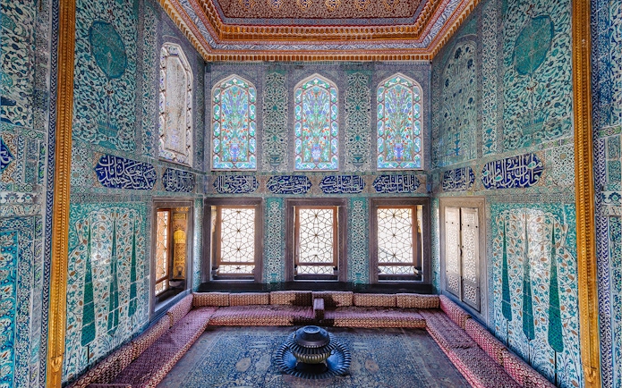 Topkapi Palace Harem section with intricate tilework and stained glass windows.
