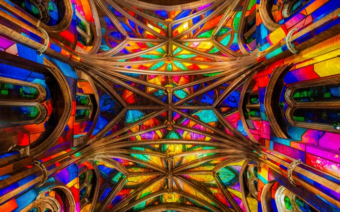 Stained glass ceiling of Manchester Cathedral during LUMINISCENCE 360° Immersive Show.