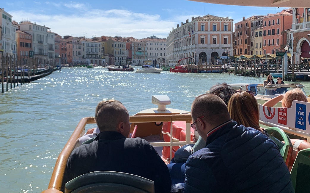 Guests on Vaporetto ACTV cruising the Grand Canal in Venice, Italy.