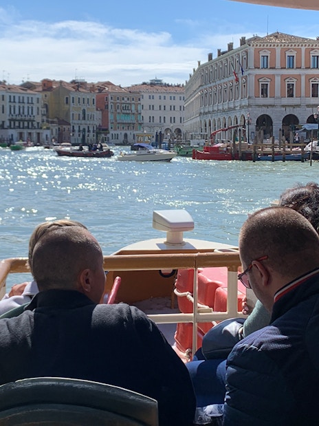 Guests on Vaporetto ACTV cruising the Grand Canal in Venice, Italy.