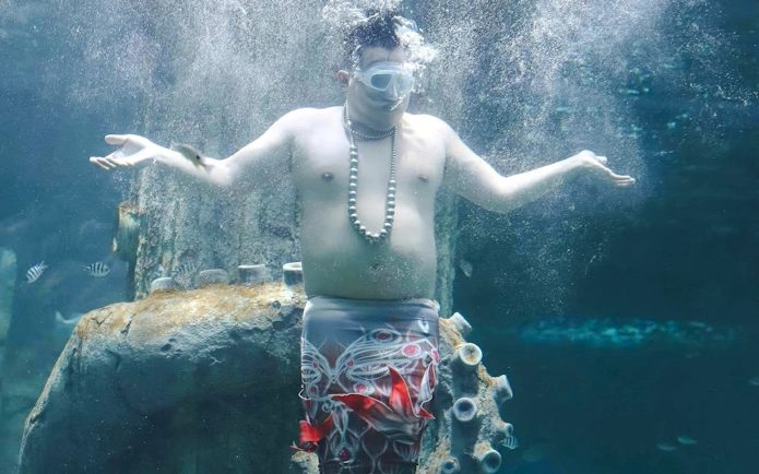 Performer underwater at Vinwonders Phu Quoc Theme Park Mermaid show.
