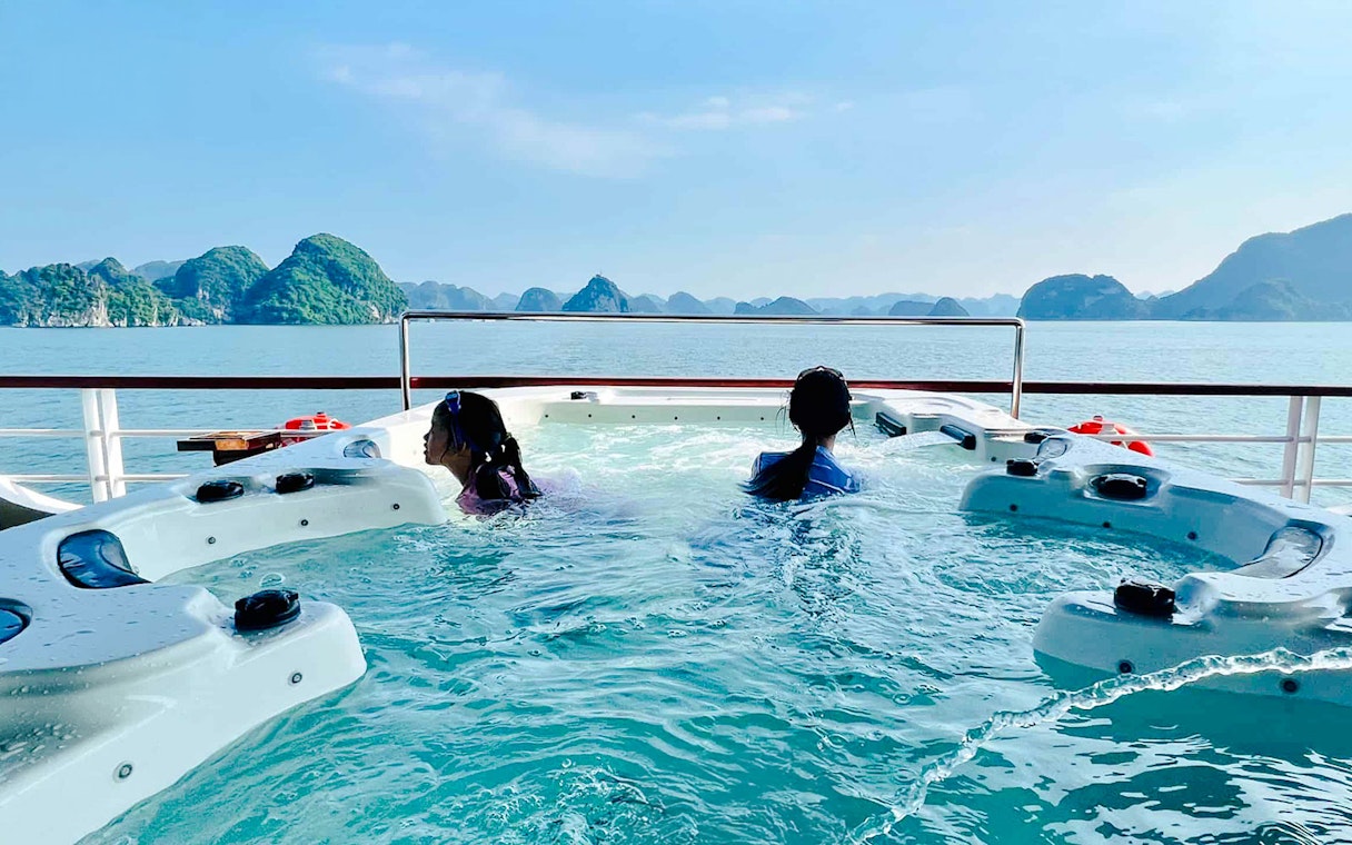 Jacuzzi on a 5-star Irish cruise in Ha Long Bay with scenic limestone islands.