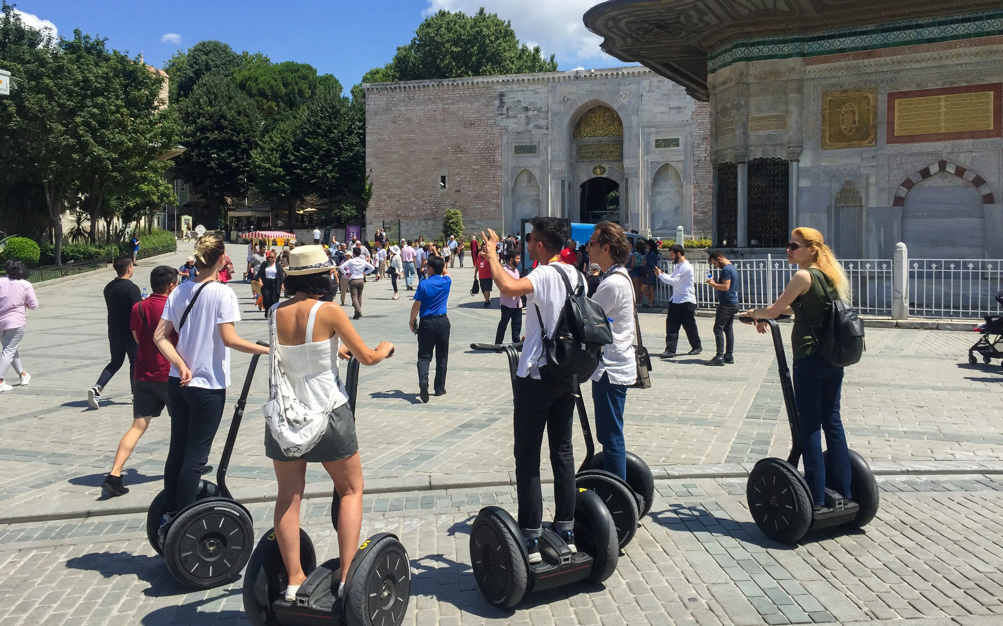 Tourists on Segways exploring a historic site in Istanbul.