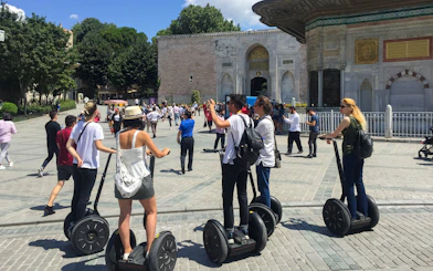 Tourists on Segways exploring a historic site in Istanbul.