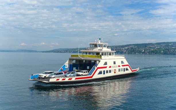 Ferry carrying cars on Lake Zurich during a sightseeing cruise.