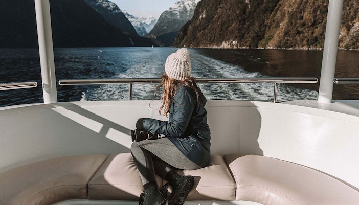 Lady enjoying the view at Milford Sound