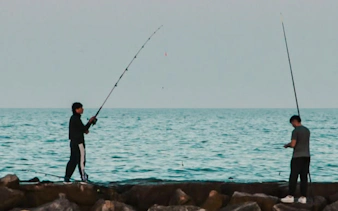 Fishing on rocky Atlantic shore at Oualidia, Essaouira.