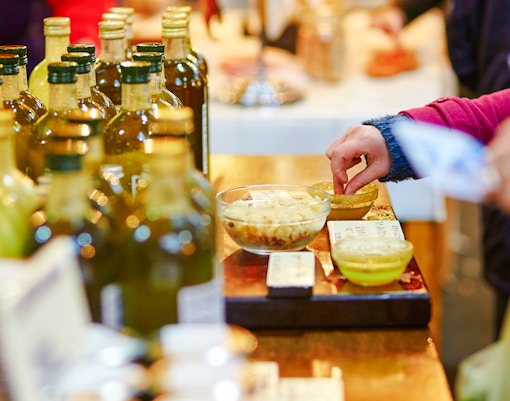 Tasting Lazio olive oils at a market in Rome.