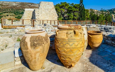 Antique Minoan vases with rope patterns at Knossos palace ruins in Greece.
