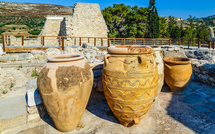 Antique Minoan vases with rope patterns at Knossos palace ruins in Greece.