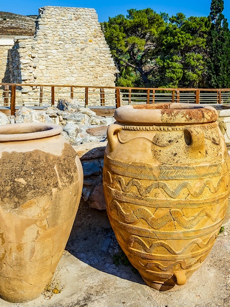 Antique Minoan vases with rope patterns at Knossos palace ruins in Greece.
