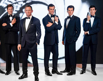 Wax figures of James Bond actors at Madame Tussauds London, part of the London City Pass attractions.