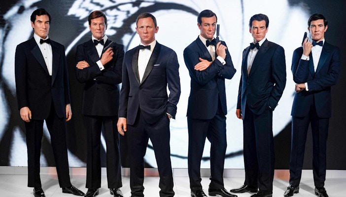 Wax figures of James Bond actors at Madame Tussauds London, part of the London City Pass attractions.