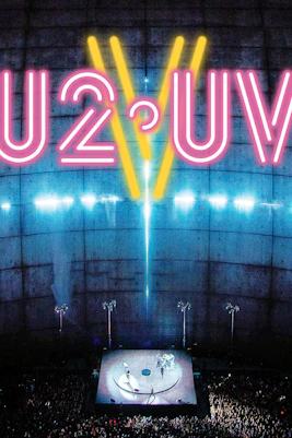 U2 concert at Sphere Las Vegas with neon lights and large audience.