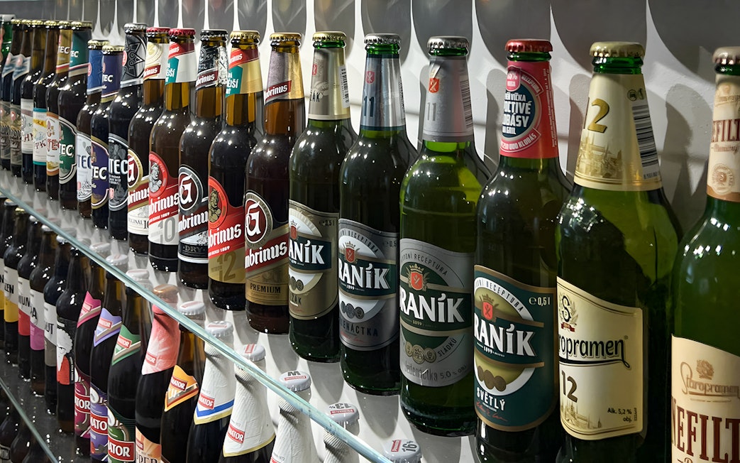 Beer bottles displayed inside Prague Beer Museum.