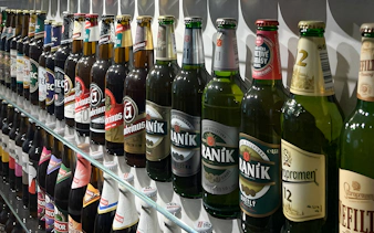 Beer bottles displayed inside Prague Beer Museum.