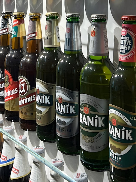 Beer bottles displayed inside Prague Beer Museum.