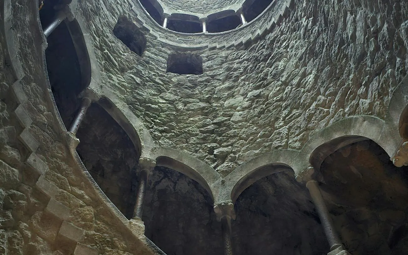 Quinta da Regaleira Initiation Well interior, Lisbon to Porto transfer stop.