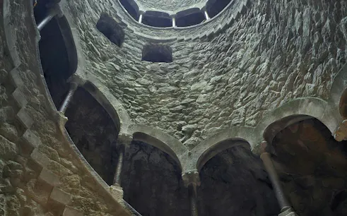 Quinta da Regaleira Initiation Well interior, Lisbon to Porto transfer stop.