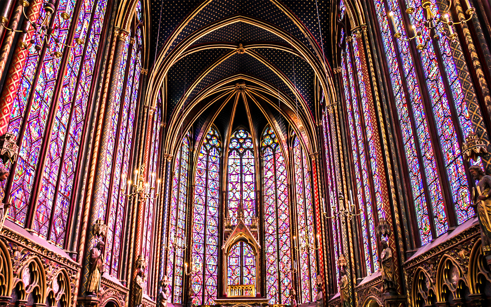 Sainte Chapelle's intricate stained glass windows in Paris, France.
