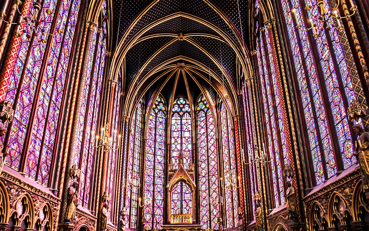 Sainte Chapelle's intricate stained glass windows in Paris, showcasing vibrant colors and Gothic architecture.