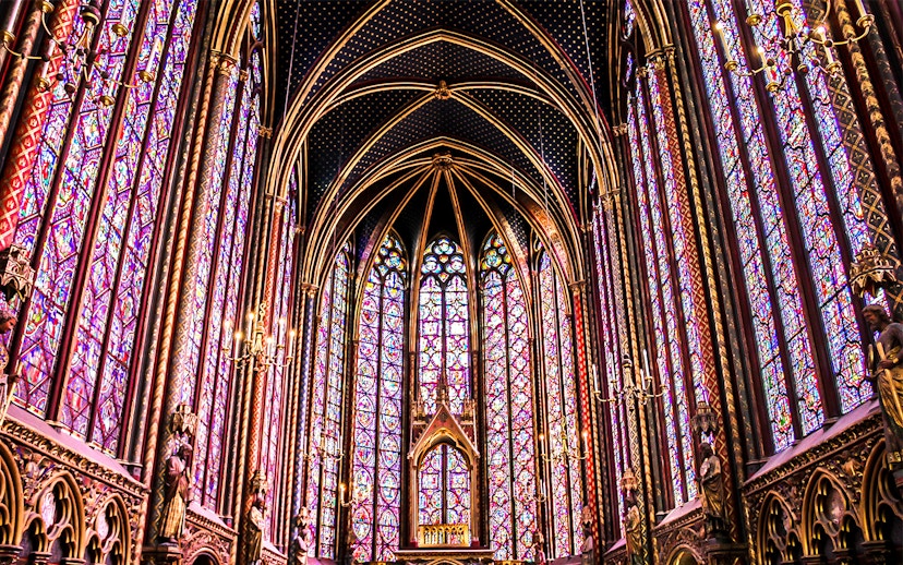 Sainte Chapelle's intricate stained glass windows in Paris, showcasing vibrant colors and Gothic architecture.