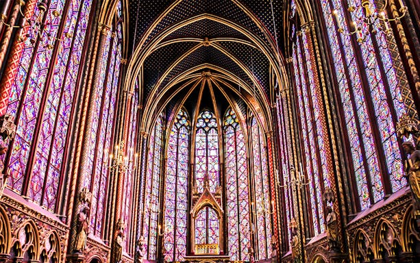 Sainte Chapelle's intricate stained glass windows in Paris, showcasing vibrant colors and Gothic architecture.