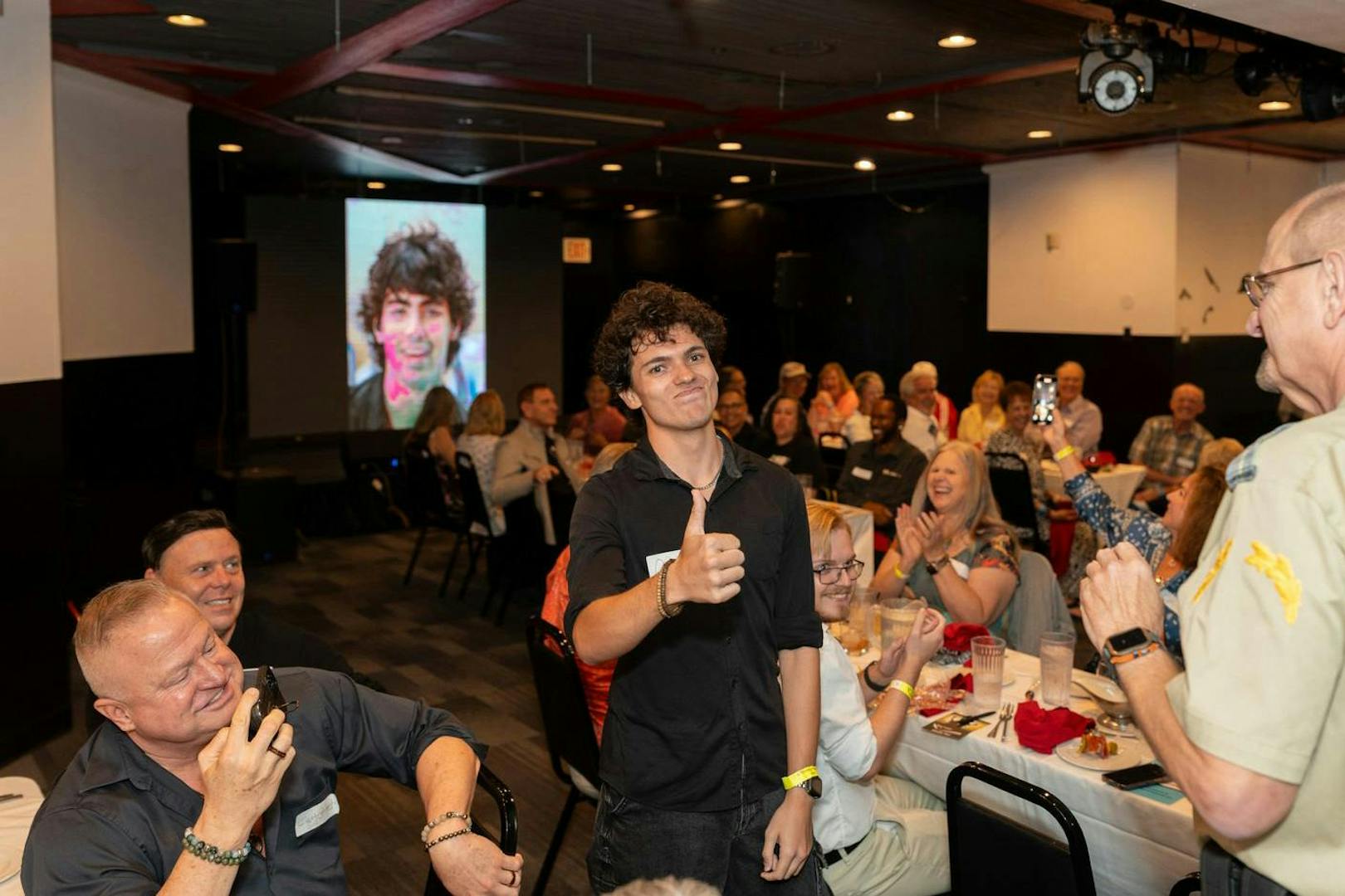 Dinner theater audience enjoying "Marriage Can Be Murder" show in Las Vegas.