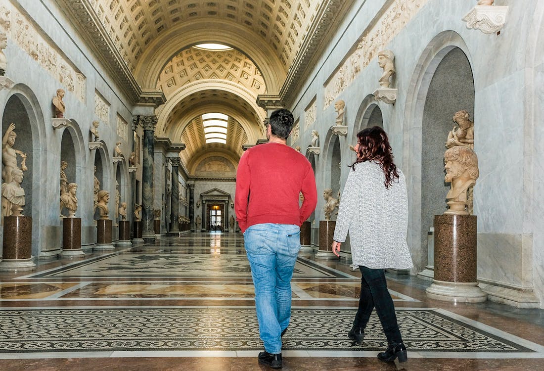 Guided tour group in Braccio Nuovo, Vatican Museums, Rome, Italy, early morning exploration.