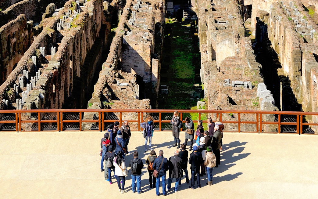 Tour group with guide at the Colosseum in Rome, part of the 'Rome in a Day' tour.