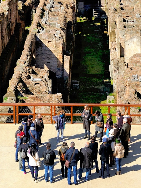 Tour group with guide at the Colosseum in Rome, part of the 'Rome in a Day' tour.
