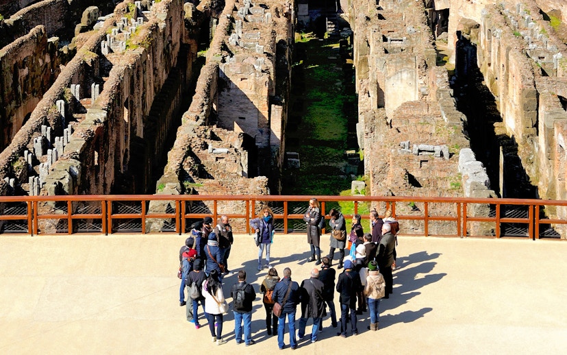 Tour group with guide at the Colosseum in Rome, part of the 'Rome in a Day' tour.