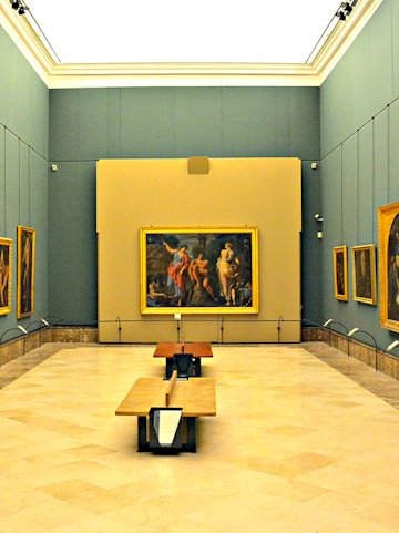 Interior of Museo di Capodimonte, Naples, featuring classic paintings on display.