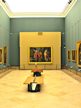 Interior of Museo di Capodimonte, Naples, featuring classic paintings on display.