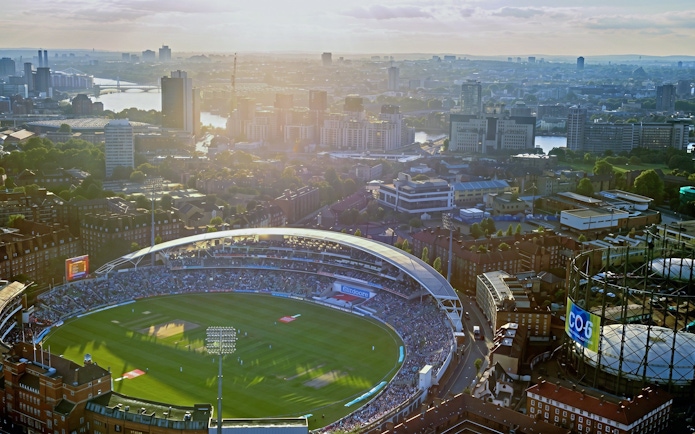 Aerial view of Kia Oval Stadium in London during a cricket match.