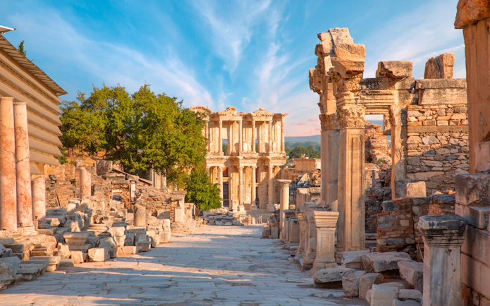 Celsus Library ruins in Ephesus, Turkey with ancient stone columns and clear sky.