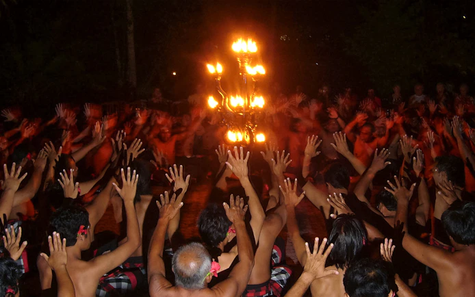 Kecak dancers encircle a fire during the Ubud Kecak & Fire Dance Show in Bali.