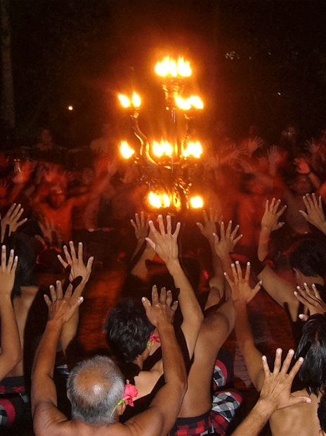 Kecak dancers encircle a fire during the Ubud Kecak & Fire Dance Show in Bali.