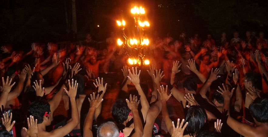 Kecak dancers encircle a fire during the Ubud Kecak & Fire Dance Show in Bali.