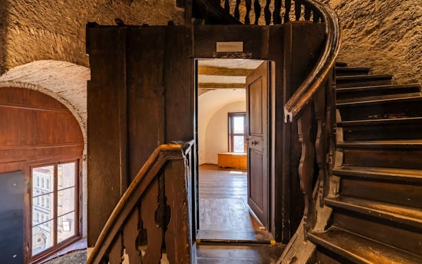 Inside view of St. Nicholas Bell Tower staircase and wooden interior, Prague.