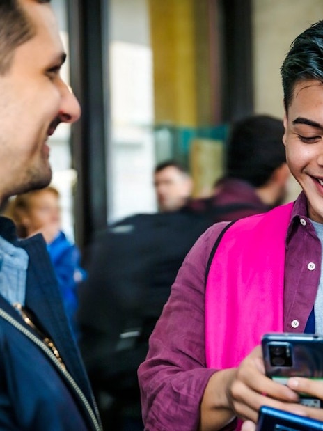 Terravision staff assisting a traveler with mobile booking