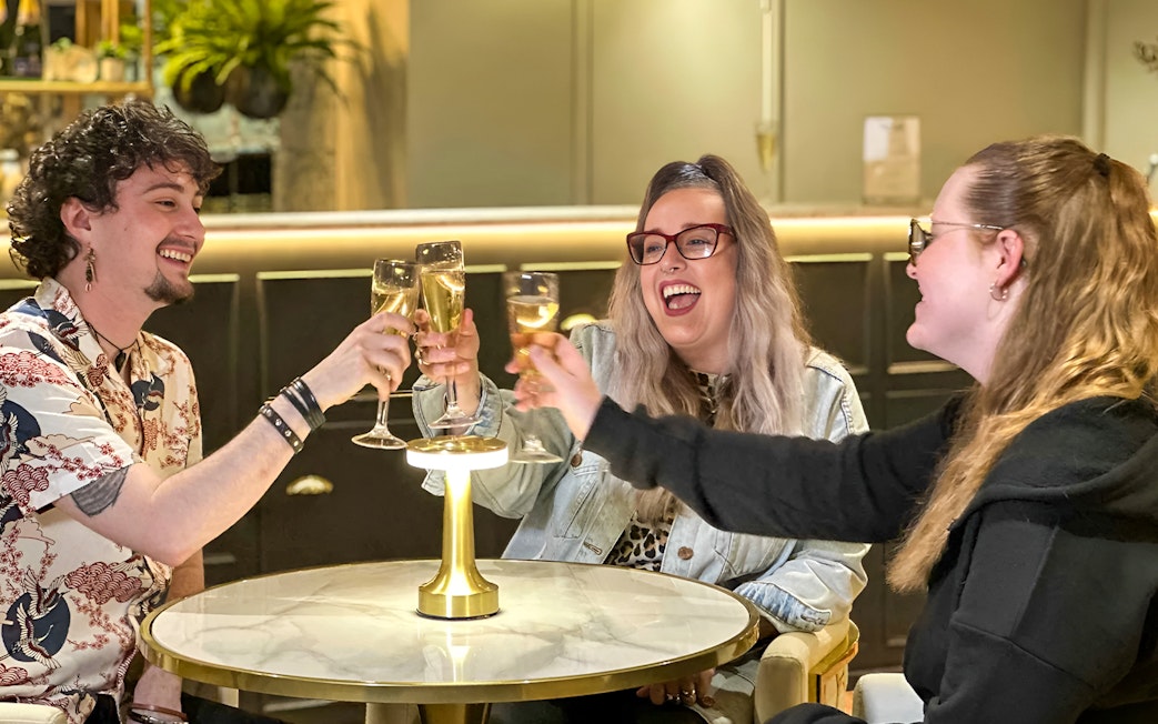 Guests enjoying champagne at Madame Tussauds London Champagne Bar.