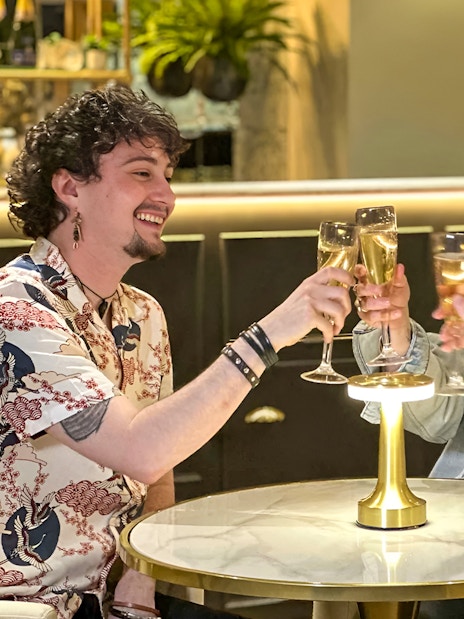 Guests enjoying champagne at Madame Tussauds London Champagne Bar.
