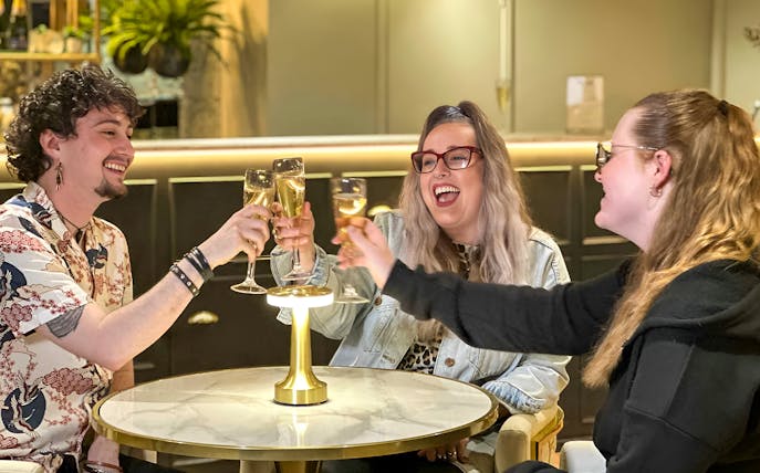Guests enjoying champagne at Madame Tussauds London Champagne Bar.