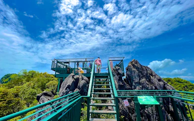 Observation deck on Hong Island with tourists enjoying views, Krabi.