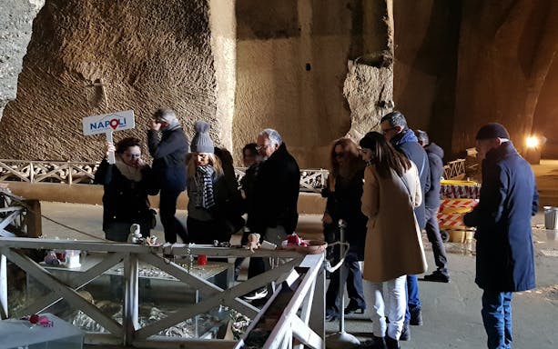 Group exploring Fontanelle Cemetery in Naples during Rione Sanità walking tour.