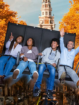 Visitors enjoying the 5D Ultimate Flight Experience at This Is Holland with Amsterdam backdrop.