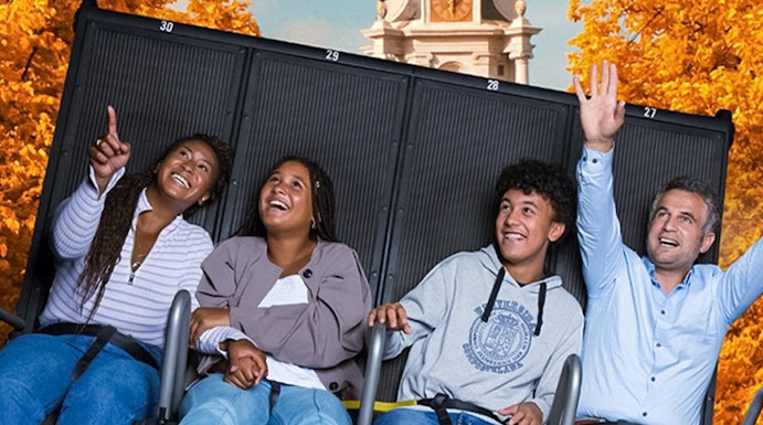Visitors enjoying the 5D Ultimate Flight Experience at This Is Holland with Amsterdam backdrop.